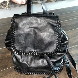 Black backpack with black metal trim by Forever 21